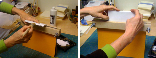 Fanning the spine for glue and then bringing the text block upright to squeeze and consolidate